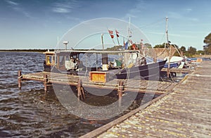 Fishing boats at the pier - retro look