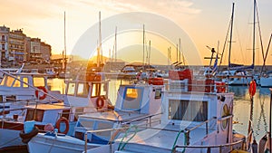 Fishing boats in the port of Heraklion at sunset