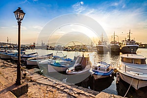Fishing boats in port of Sozopol at sunset