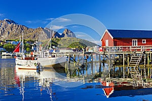 Fishing boats in Reine Village, Lofoten Islands,  Norway.  The Typical Norwegian fishing village of Reine under midnight sun,