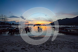 Fishing boats resting on a beach