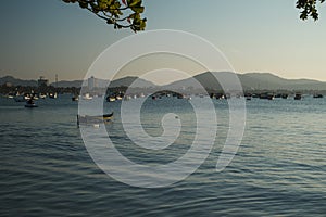 Fishing boats in the sea at the sunset photo