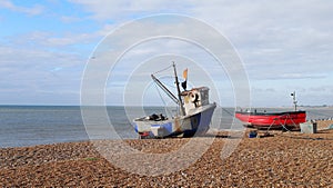 Fishing boats on the seafront in Hythe, Kent photo