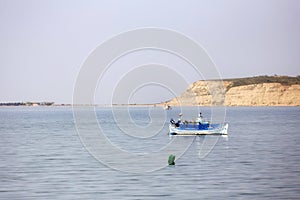 fishing boats on shore in summer, Halkidiki Greece