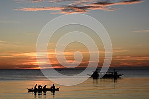 Fishing boats silhouettes at sunset. Boracay Island. Western Visayas. Philippines