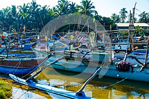 Fishing boats stand in Harbour, fish market in Sri Lanka