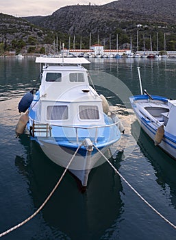 Fishing boats stand in the marina of the resort town of Methana in the Peloponnese in Greece