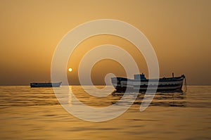 Fishing boats at the sunrise