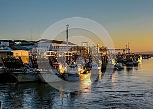 Fishing boats at sunset in Isla Cristina harbour, Huelva, province of Andalusia, Spain