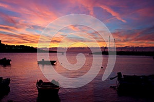 Fishing boats at sunset in port