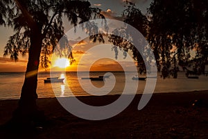 Fishing boats at sunset on the Public beach of Albion in the west of the republic of Mauritius.