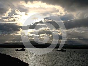 Fishing boats at sunset on Puerto Natales harbor, Patagonia Chile