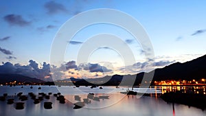 Fishing boats with sunset reflection