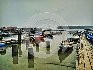 Fishing boats in Teluk Bayu Floating Chalets Area