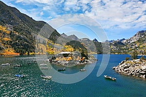 Fishing boats turn round picturesque island