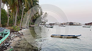 Fishing boats on the water of the Indian Ocean Vietnam Phu Quoc island the beauty and dirt of poor life in Vietnam on