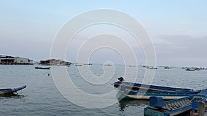 Fishing boats on the water of the Indian Ocean Vietnam phu Quoc island The beauty and dirt of poor life in Vietnam on