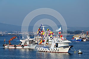 Fishing boats white with flags