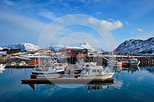 Fishing boats and yachts on pier in Norway