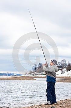 Fishing boy on the river
