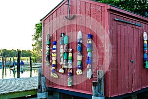 Fishing Buoys on Boathouse at Marina