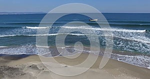 Fishing in the cold waves of the Bulgarian beach on the Black Sea