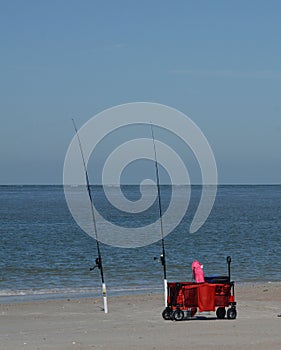 Fishing poles on Fernandina Beach, Cumberland Sound, Fort Clinch State Park, Nassau County, Florida USA