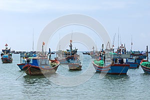 Fishing fleet anchored in front of village in Central Vietnam.