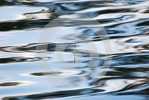 Fishing float in water surface