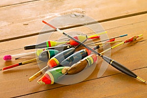fishing floats, on the background of a wooden table close-up, top view, selective focus. Fishing concept