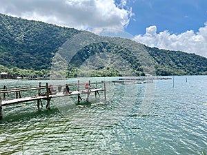 fishing with friends with a beautiful view on the lake