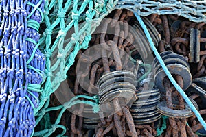 Fishing gear strewn along the floor on a marina jetty