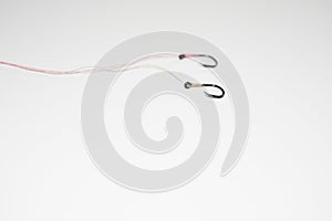 The fishing hook is placed on a white background with space