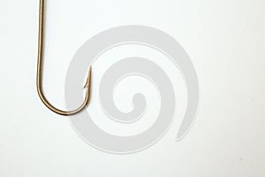 Fishing hook on a white paper background