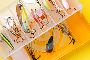 Fishing hooks and bait in a set for catching different fish