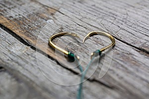 Fishing hooks in the shape of a heart