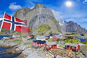 Fishing hut rorbu in the Hamnoy and Lilandstinden mountain In Background, Reine, Lofoten islands, Norway