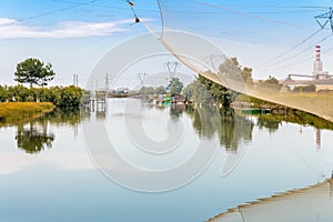 Fishing huts in the quiet of brackish lagoon