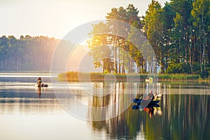 Fishing in a lake at sunshine photo