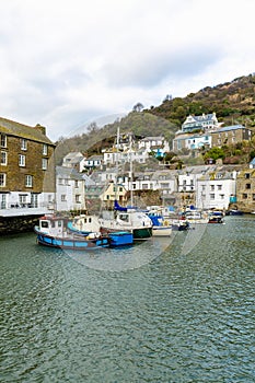 Fishing and Leisure boats moored in the historic harbour at Polperro, Cornwall