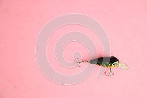 Fishing lure isolated on a pink background