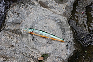 Fishing lure - wobbler (hardbait) isolated in a creek