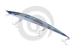 Fishing lure, wobbler, with three double hooks on an isolated white