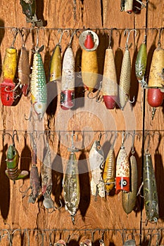 Fishing lures hanging against wall