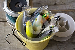 Fishing lures in a mug