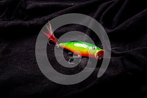 Fishing lures on on various black background background. Fishing fake bait are another alternative to angling. used in conjunctio
