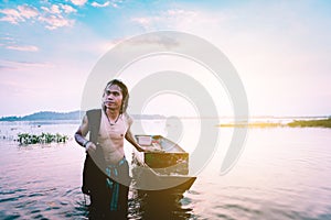 Fishing man dragging the boat back