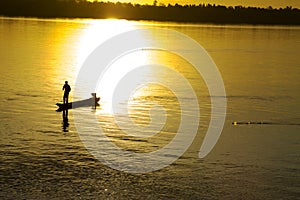 Fishing man and sunrise