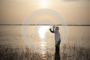 Fishing man at sunset.