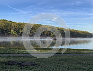 Fishing in the morning at the lake in springtime